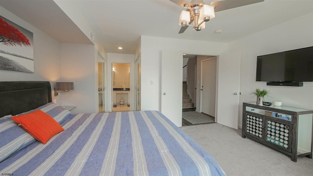 carpeted bedroom featuring ensuite bath