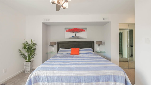 bedroom featuring carpet flooring, visible vents, and baseboards