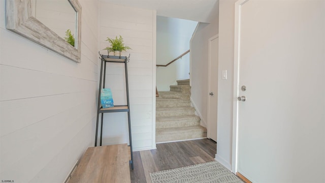 staircase with wood finished floors