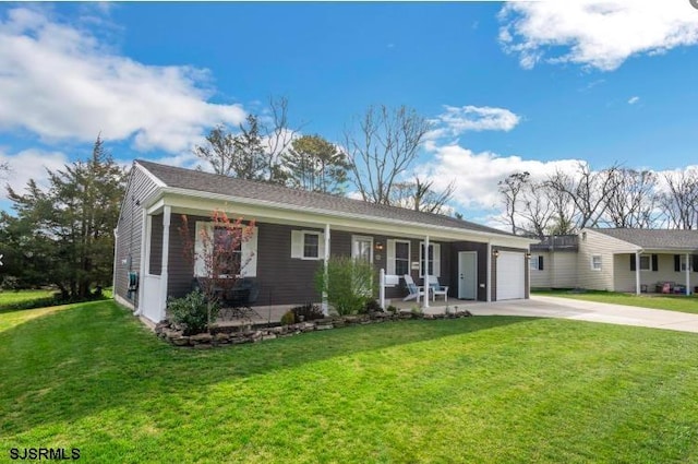 single story home featuring a garage, a front yard, and concrete driveway