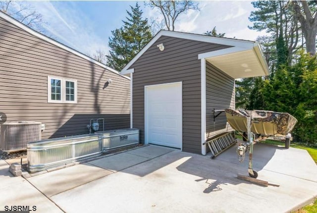 detached garage with central AC and driveway