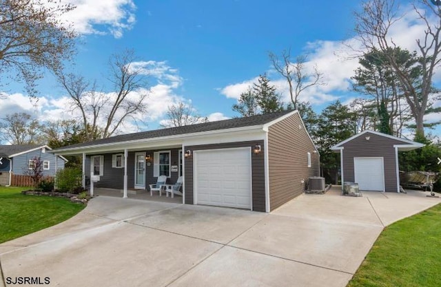 ranch-style house featuring a porch, central AC, and a front yard