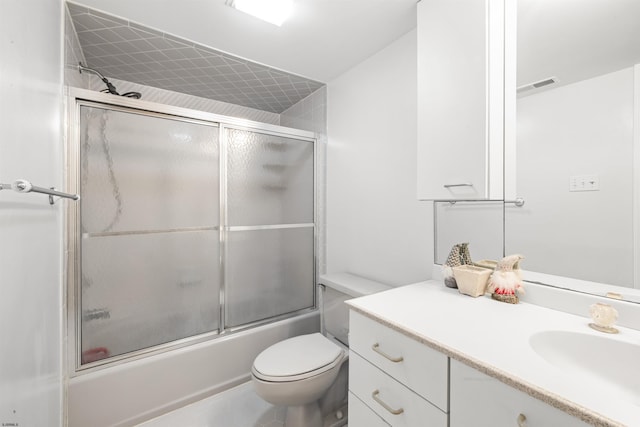 full bath with visible vents, enclosed tub / shower combo, vanity, and toilet