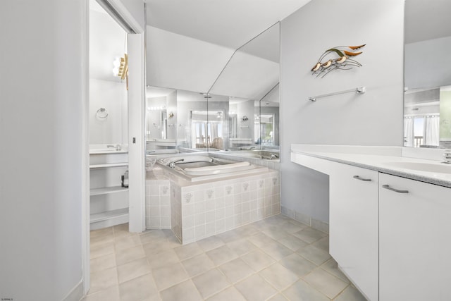 full bath with baseboards, a garden tub, vanity, and tile patterned floors