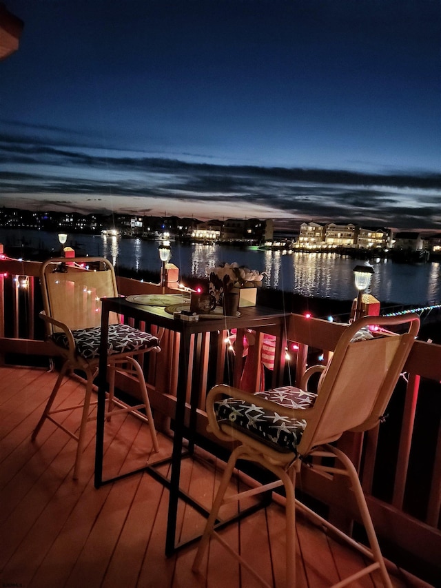 balcony at twilight with a water view