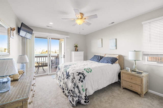 bedroom with access to outside, visible vents, baseboards, and light colored carpet