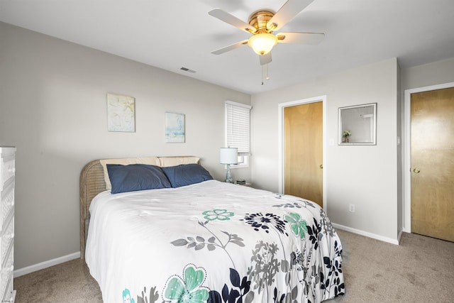 bedroom featuring a ceiling fan, baseboards, visible vents, and carpet flooring