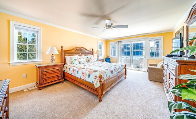 bedroom with light carpet, ornamental molding, multiple windows, and baseboards