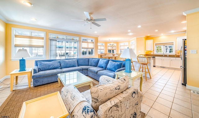 living area featuring light tile patterned floors, baseboards, crown molding, and recessed lighting