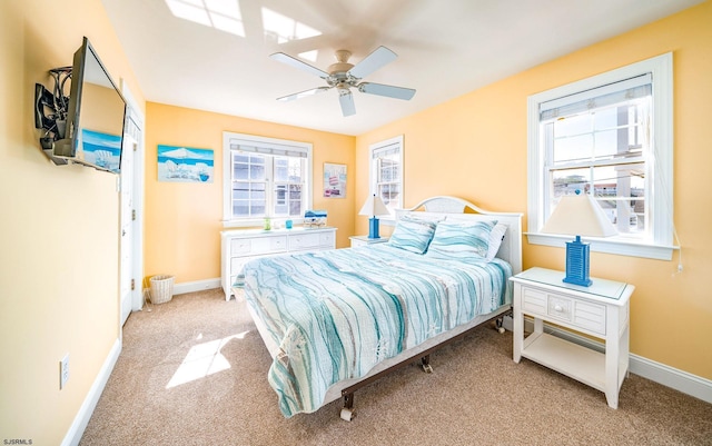 bedroom featuring carpet floors, ceiling fan, and baseboards