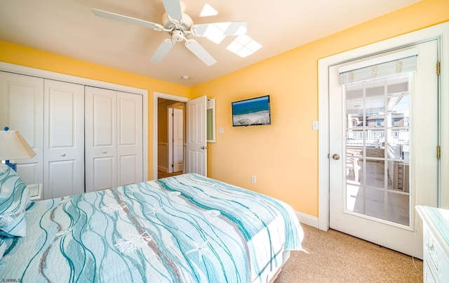 bedroom featuring ceiling fan, baseboards, a closet, and light colored carpet