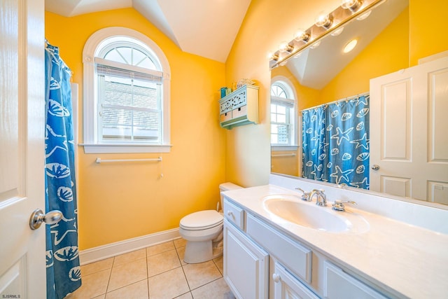 full bath with lofted ceiling, toilet, vanity, baseboards, and tile patterned floors