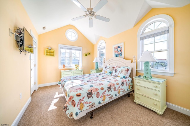 carpeted bedroom with a ceiling fan, lofted ceiling, visible vents, and baseboards