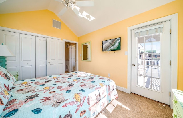 bedroom featuring a closet, visible vents, light carpet, vaulted ceiling, and access to outside