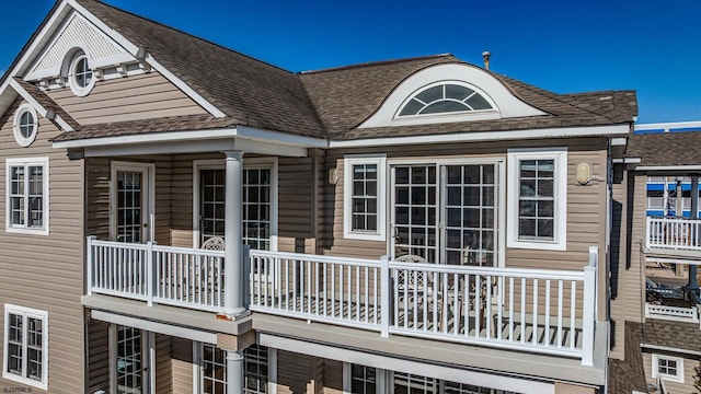 view of property exterior featuring roof with shingles