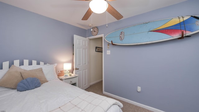 bedroom featuring carpet, baseboards, and ceiling fan