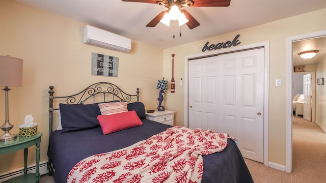 bedroom featuring a closet, light colored carpet, baseboard heating, a wall mounted AC, and baseboards