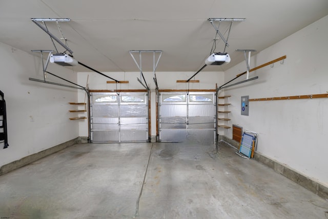 garage with electric panel and a garage door opener