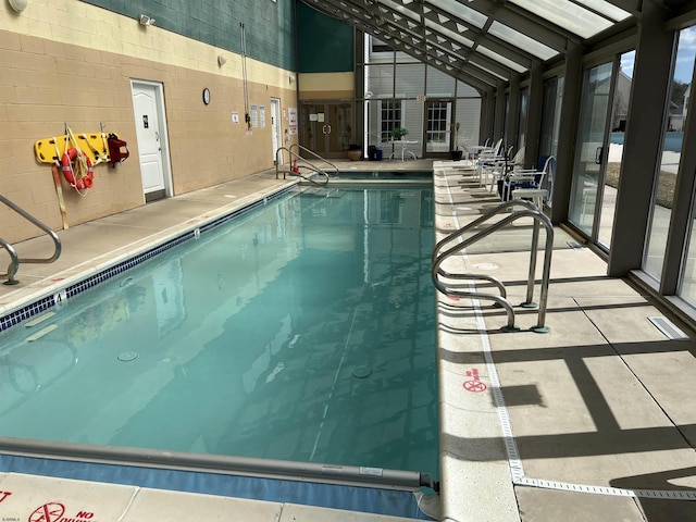 community pool featuring a lanai and a patio