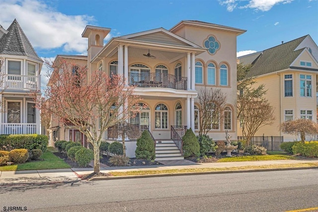 view of front of home featuring a balcony and stucco siding