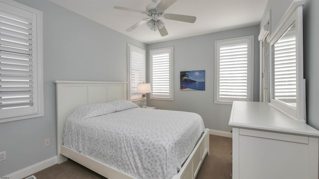 bedroom featuring ceiling fan, carpet flooring, and baseboards