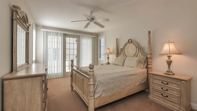 bedroom featuring light carpet, ceiling fan, multiple windows, and access to exterior