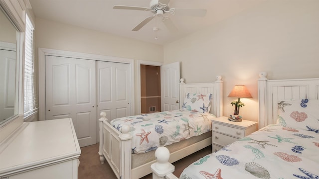 bedroom with ceiling fan, multiple windows, and a closet