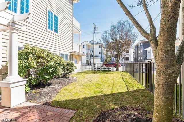 view of yard with a residential view and fence