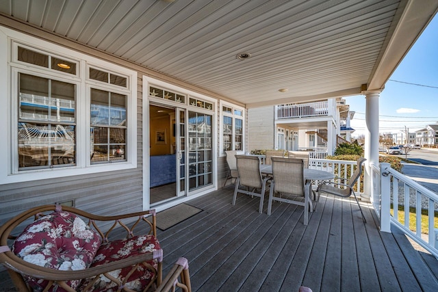 wooden deck featuring outdoor dining space