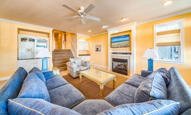 tiled living room with ornamental molding, recessed lighting, a fireplace, and stairway