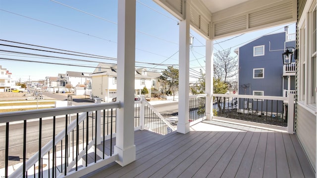 wooden deck with a residential view