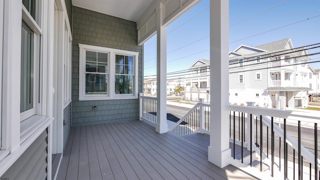 wooden terrace featuring a residential view