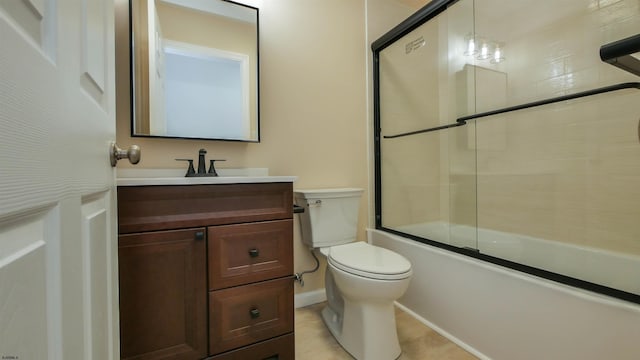 full bathroom featuring toilet, vanity, and enclosed tub / shower combo