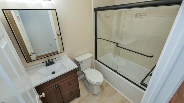 bathroom featuring shower / bath combination with glass door, vanity, and toilet