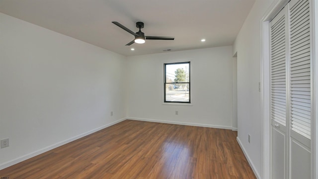 unfurnished bedroom featuring baseboards, a ceiling fan, dark wood-style flooring, a closet, and recessed lighting