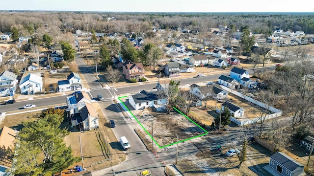 birds eye view of property with a residential view