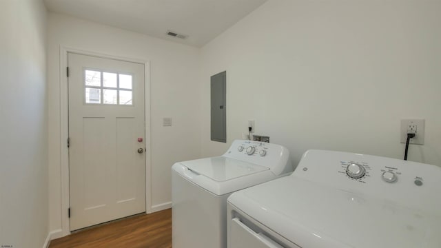 laundry area featuring laundry area, electric panel, visible vents, dark wood-style floors, and independent washer and dryer