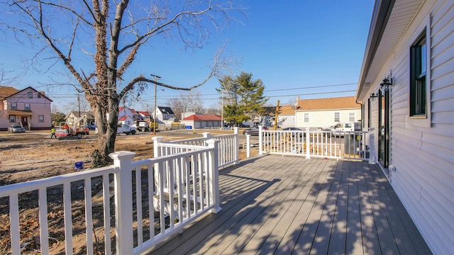 wooden terrace with a residential view