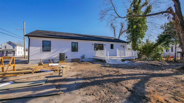 back of property featuring a wooden deck