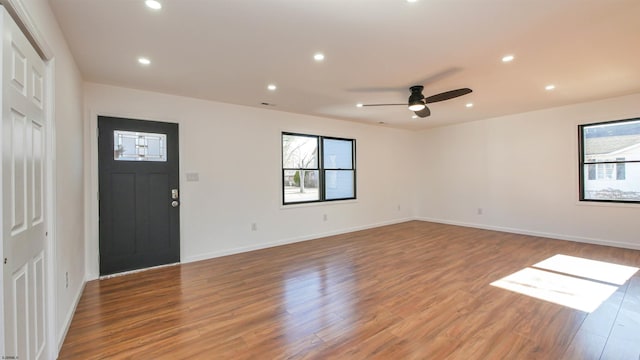 foyer featuring recessed lighting, wood finished floors, and a healthy amount of sunlight