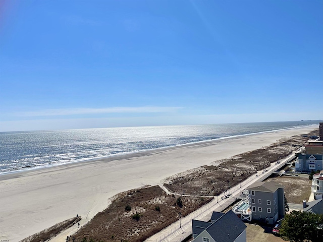 aerial view featuring a view of the beach and a water view