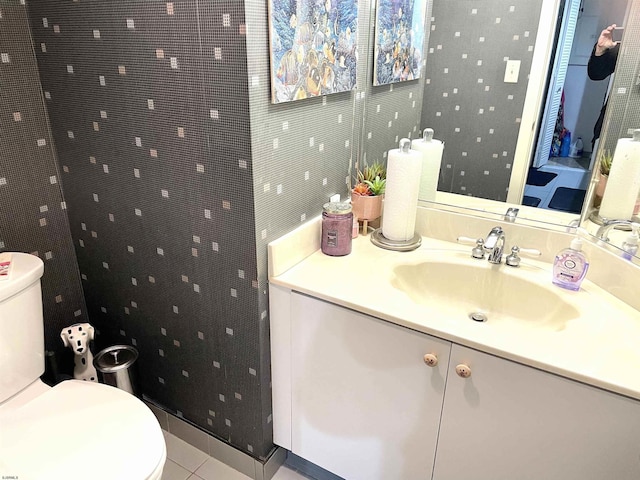 bathroom with tile patterned floors, toilet, and vanity