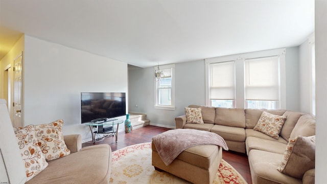 living area featuring baseboards and wood finished floors