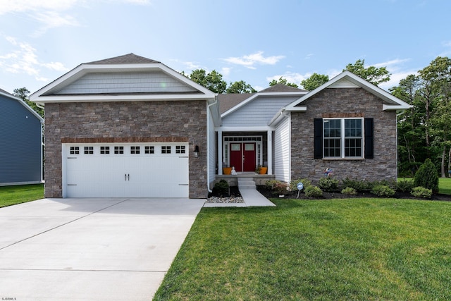 view of front of house with an attached garage, concrete driveway, and a front yard