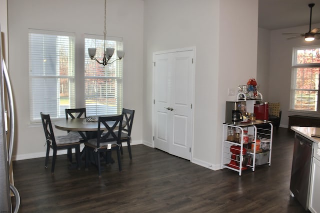 dining room featuring ceiling fan with notable chandelier, baseboards, and dark wood-style flooring