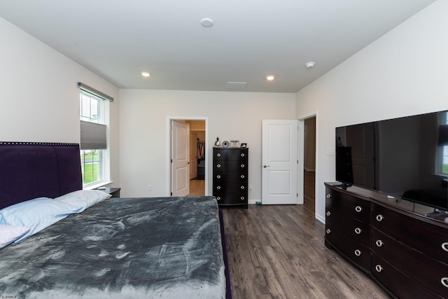 bedroom featuring recessed lighting, baseboards, and dark wood-style flooring