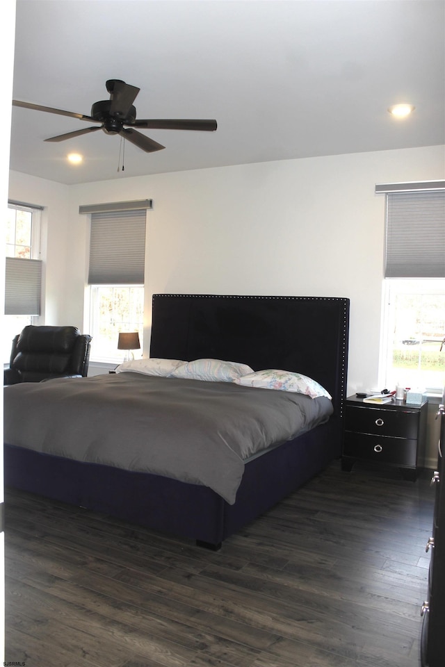 bedroom with recessed lighting, dark wood-style floors, and a ceiling fan