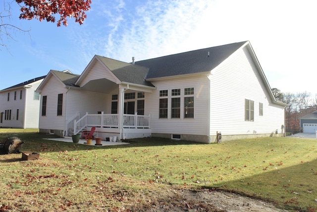 rear view of property with a lawn