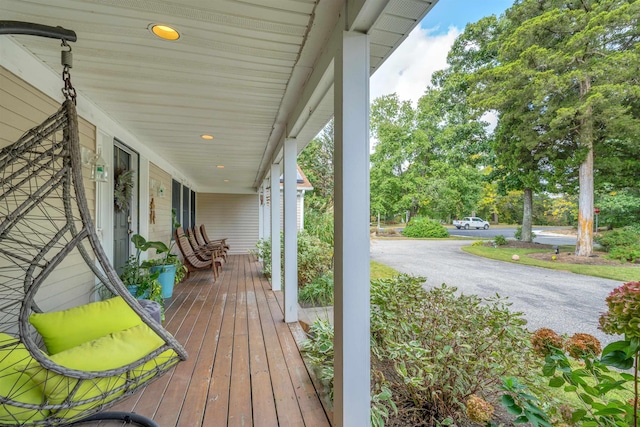 wooden terrace with a porch