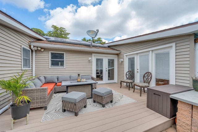 wooden deck featuring an outdoor living space and french doors